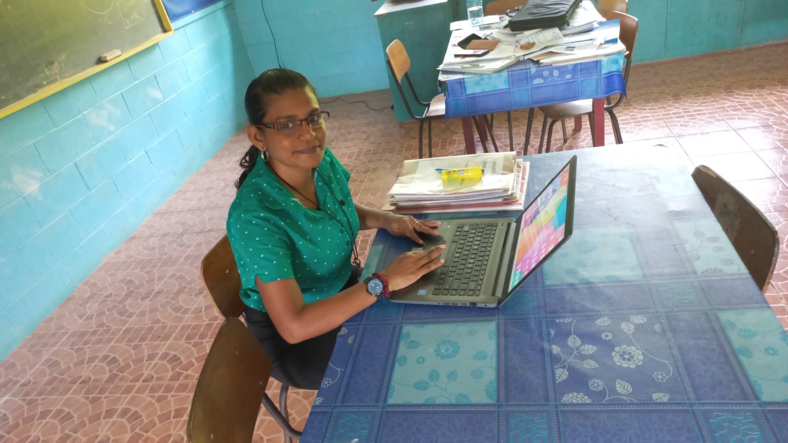 Woman smiling while using laptop computer